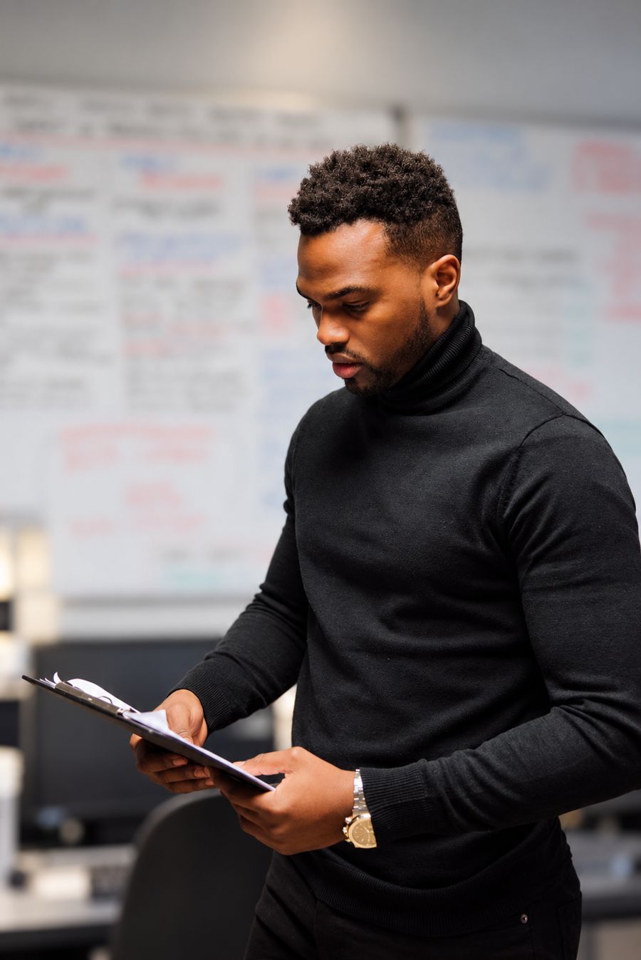 Tino Jalo reviewing notes in an office
